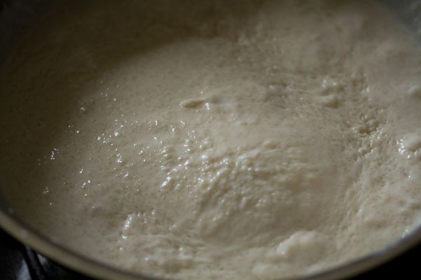 mixing the rice-milk mixture continuously. 