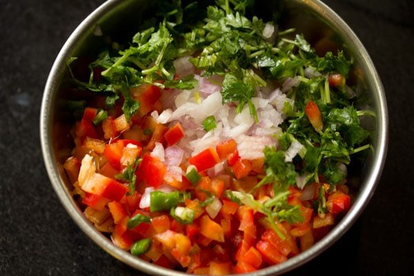 finely chopped onion, finely chopped red bell pepper, chopped green chili and chopped coriander leaves added in the bowl. 