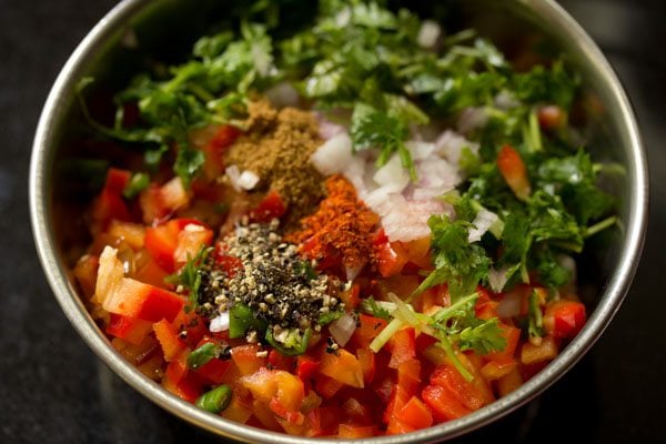 crushed black pepper, cumin powder and red chili powder added in the bowl. 