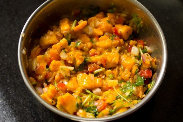 mixing ingredients for mango salsa well. 