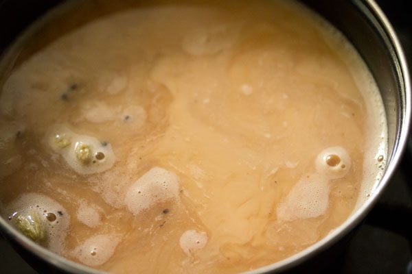 Masala tea with milk in a pan