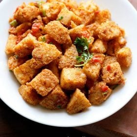 masala idli on a white plate.