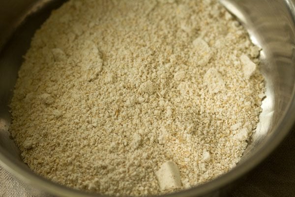 prepared oats flour added in a mixing bowl. 