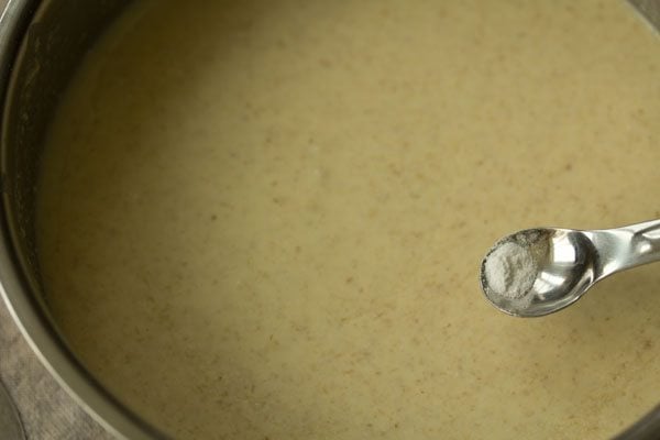 adding baking soda to batter. 