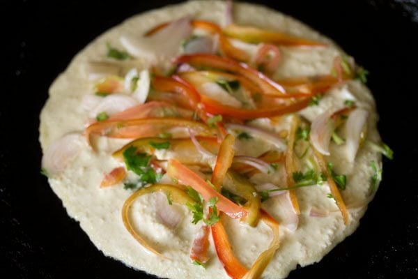 vegetables spread on the batter. 