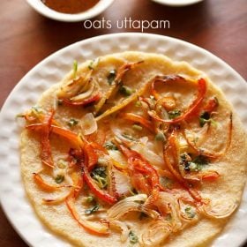 oats uttapam served on a white plate with bowls of chutney kept in the background and text layover.