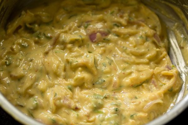 prepared onion fritters batter in the bowl