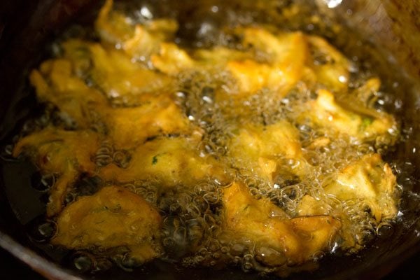 frying onion fritters in hot oil. 
