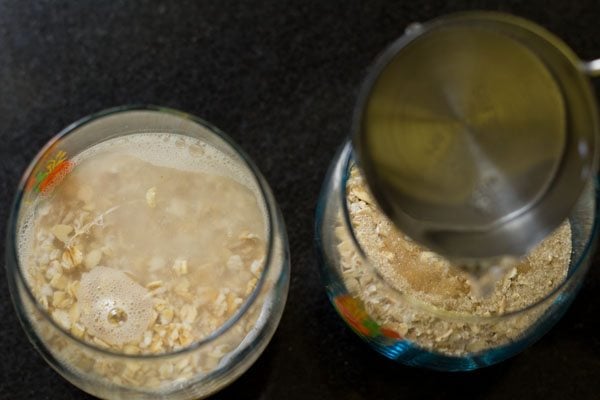 water, oats and sweetener in a cup