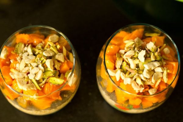 overnight oats, chia seeds, sapota and mangoes topped with dry fruit