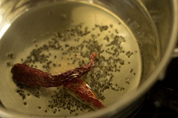 dried red chilies added to pan. 