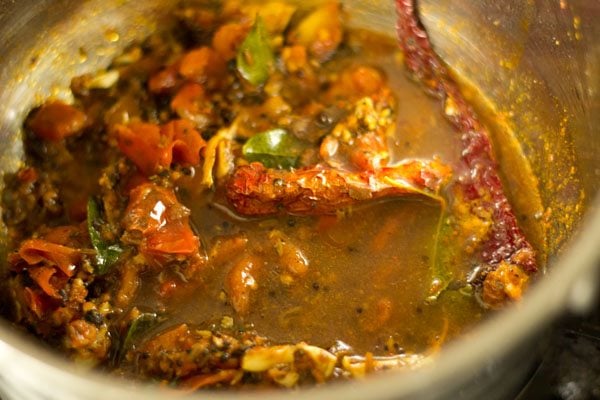 prepared tamarind pulp added to the pan. 