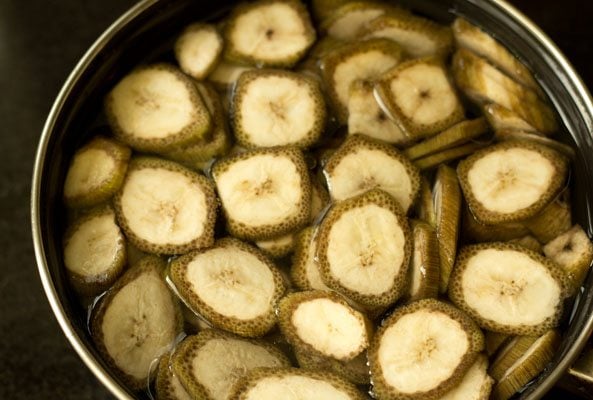 sliced raw unripe bananas in water