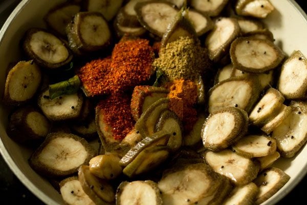 adding spices for vazhakkai fry