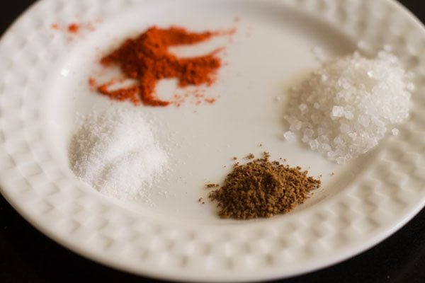 spices kept on a plate for raw mango salad. 