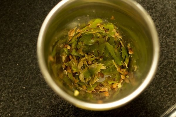 ginger and green chili crushed in a mortar pestle. 