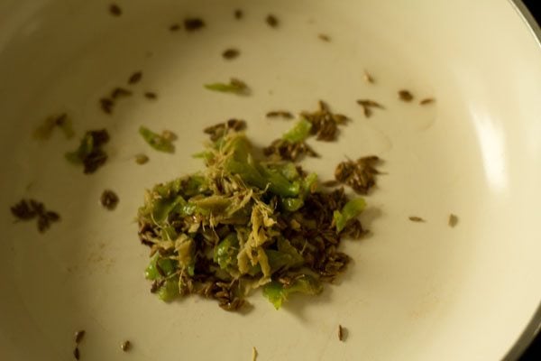 crushed ginger and green chili added to pan. 