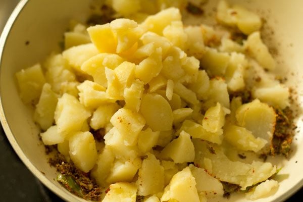 boiled potato cubes added to pan. 