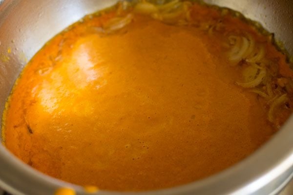 adding ground coconut-spices paste.