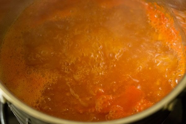 tomato broth simmering in the pan 