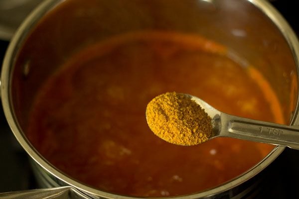 rasam powder being added