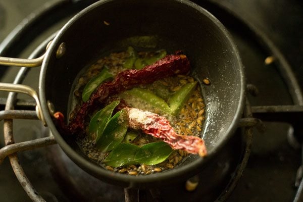 dry red chillies, curry leaves and asafetida added