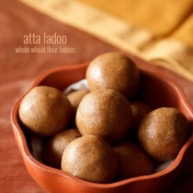 The atta ladoo comes in a brown bowl with text in the middle.