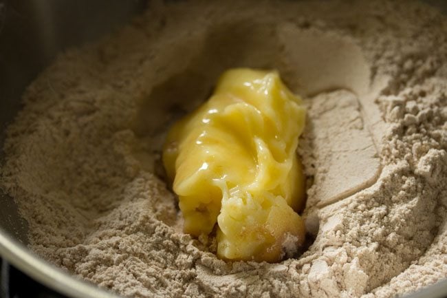 ghee added to the roasted flour in the pan. 