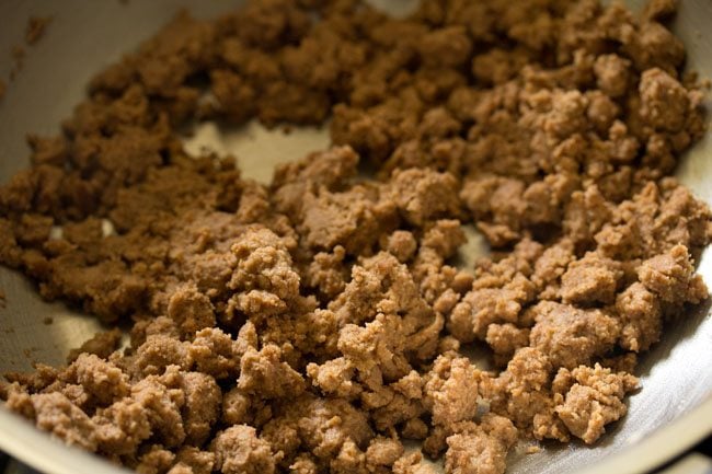 roasting the flour-ghee mixture in the pan. 