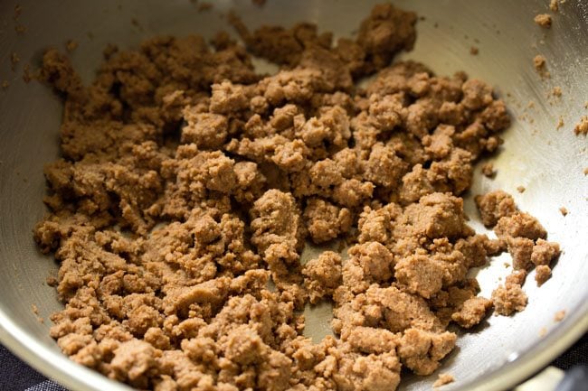 roasting the flour-ghee mixture in the pan. 