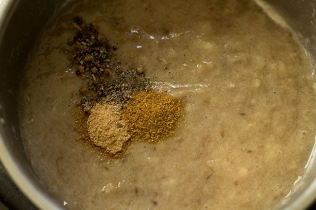 cardamom powder, ginger powder and cumin powder added to mashed bananas. 