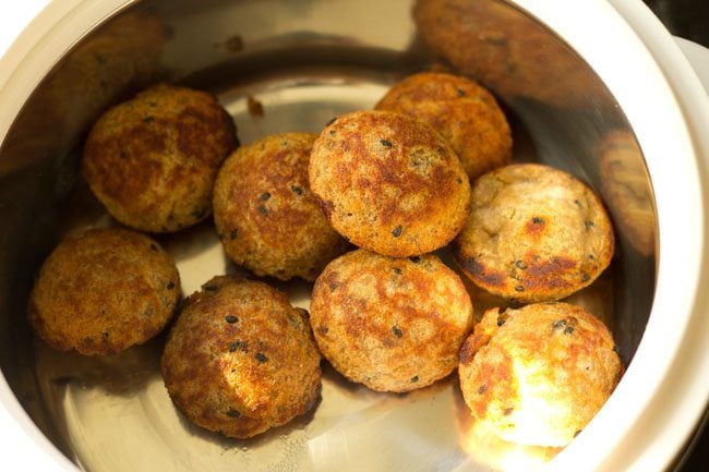 cooked banana appam in a casserole. 