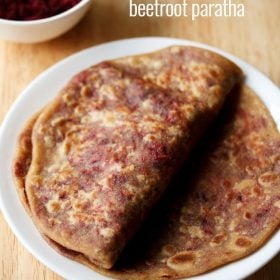 beetroot paratha served on a white plate with text layover.