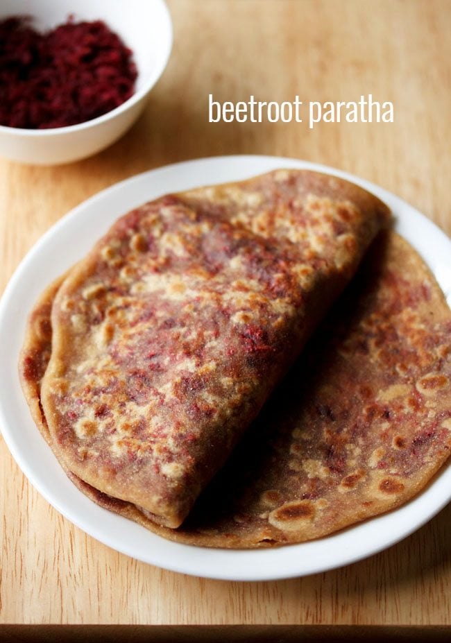 beetroot paratha served on a white plate with text layover.