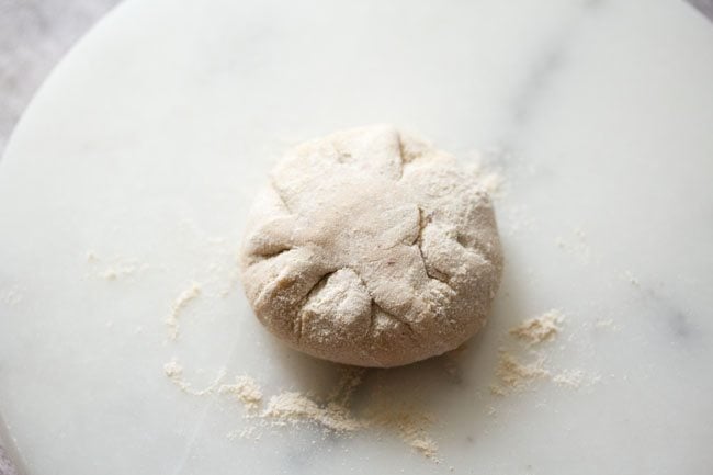 flattening the dough ball