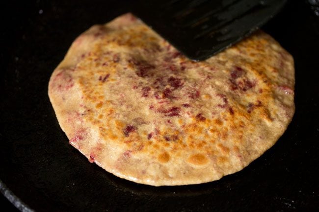 press beetroot paratha edges