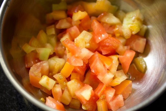 chopped tomatoes in a mixing bowl.