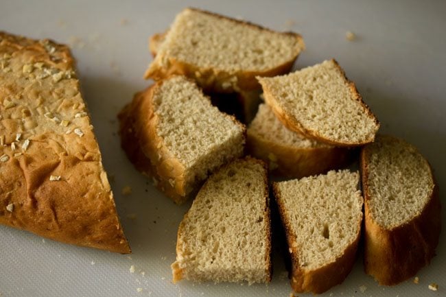slicing bread from a baguette. 