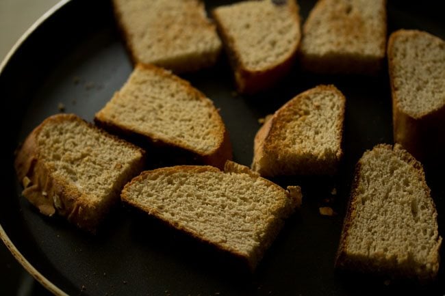 flipping croutons in skillet to toast the other side. 