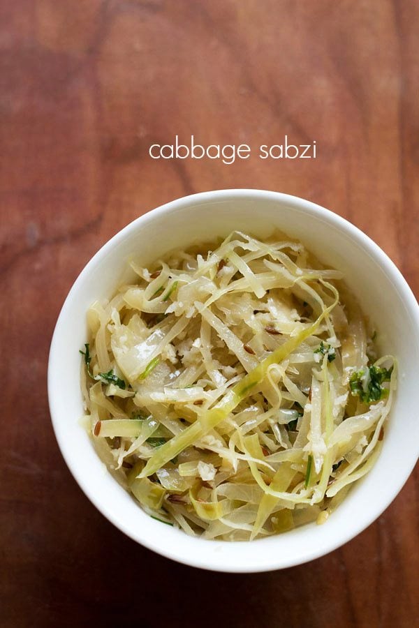 cabbage bhaji served in a white bowl with text layover.