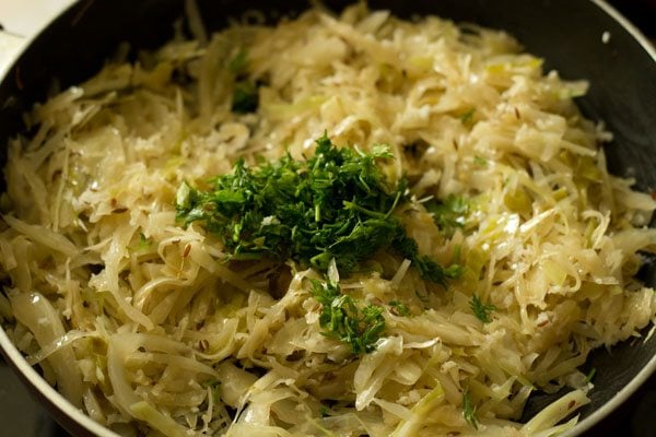 garnishing cabbage bhaji