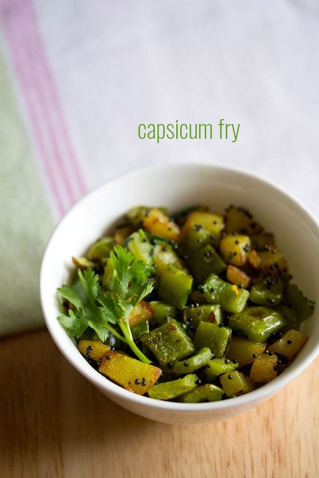 capsicum fry garnished with a coriander sprig and served in a white bowl with text layover.