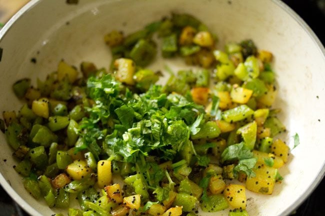 adding chopped coriander leaves