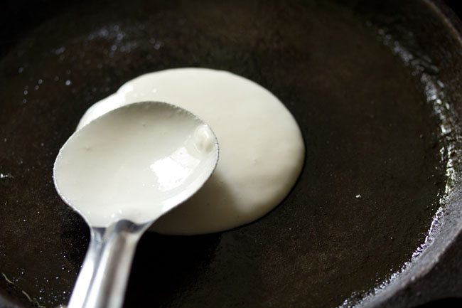 spreading dosa batter for cheese dosa recipe