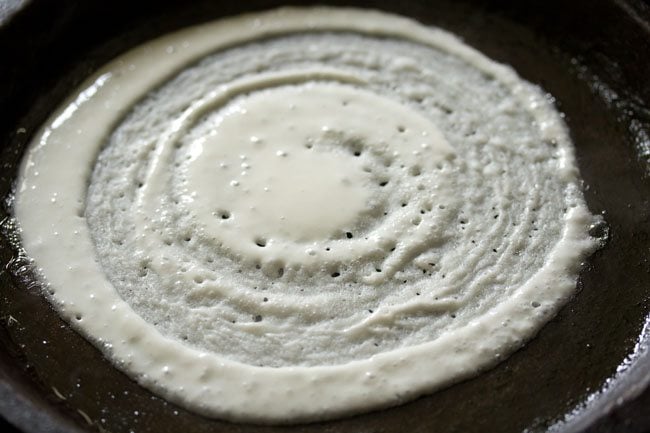 spreading dosa batter for cheese dosa recipe