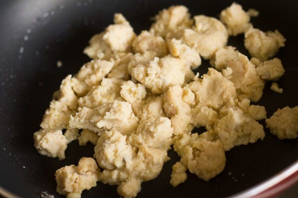 crumbled mawa in a pan