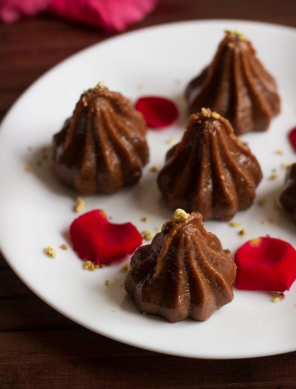 chocolate modak served on a white plate