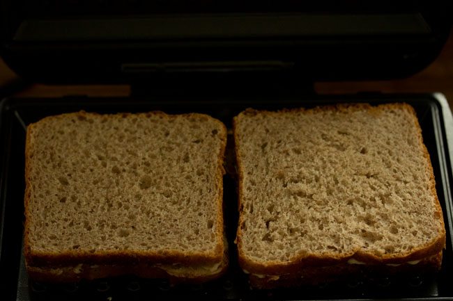 chocolate sandwich placed in a sandwich toaster