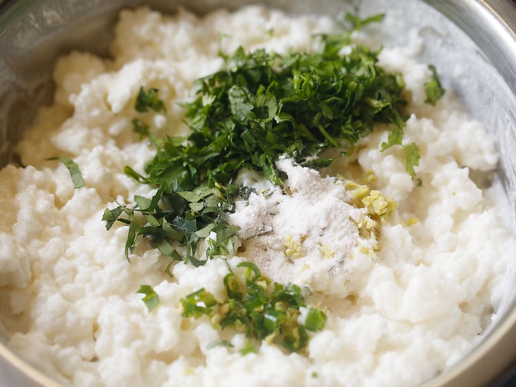 adding salt in curd rice mixture.