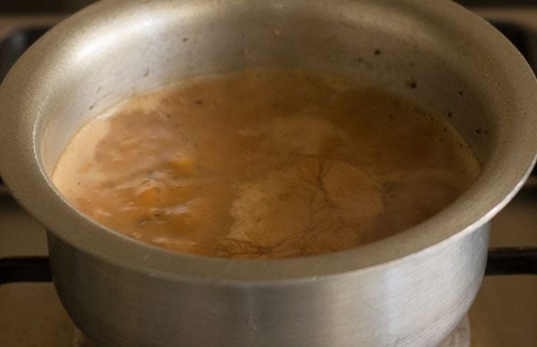 simmering the cutting chai in the pan